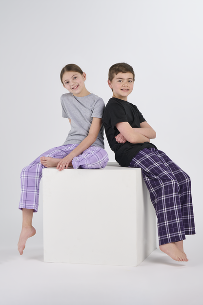 Kids wearing Boxercraft BY6624 Youth Flannel Pants in Purple/White and Lavender Carnegie Plaid | Purple/White Plaid