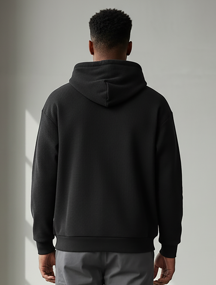 Unisex Corded Pullover Hoodie in Black – model back