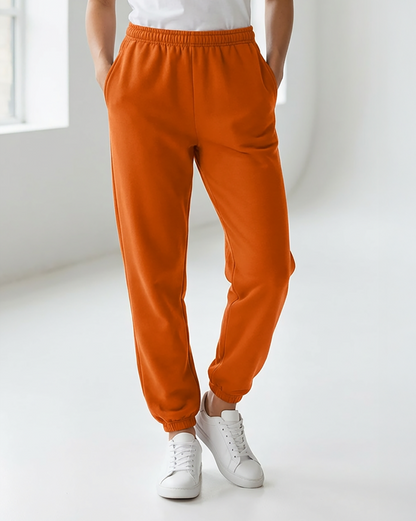 Unisex Core Fleece Pant in Orange – model front 2