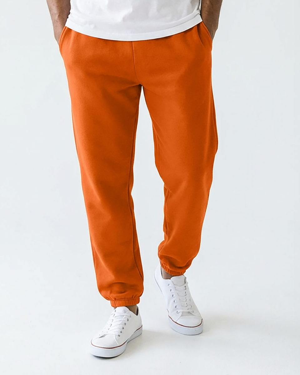 Unisex Core Fleece Pant in Orange – model front