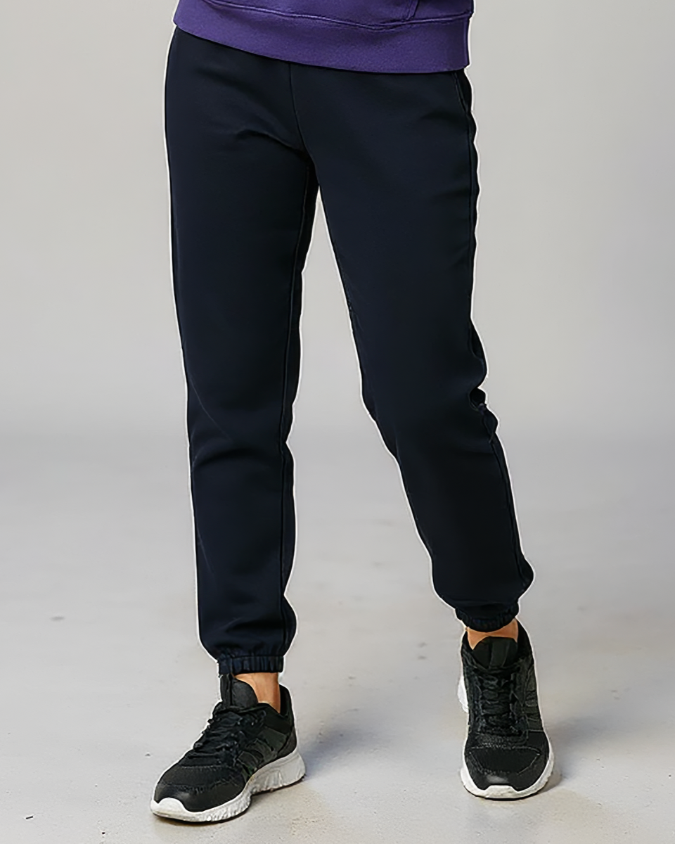 Kids' Core Fleece Pant in Black – model front