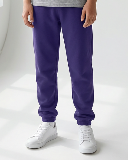 Kids' Core Fleece Pant in Purple – model front